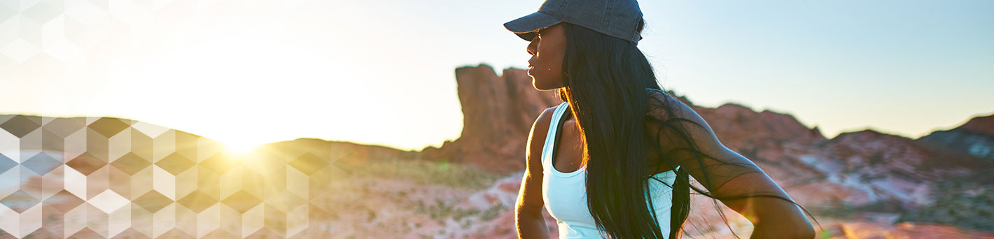 Woman exercising in desert.