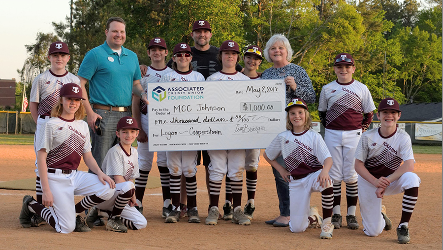 ACU employees donating a big check