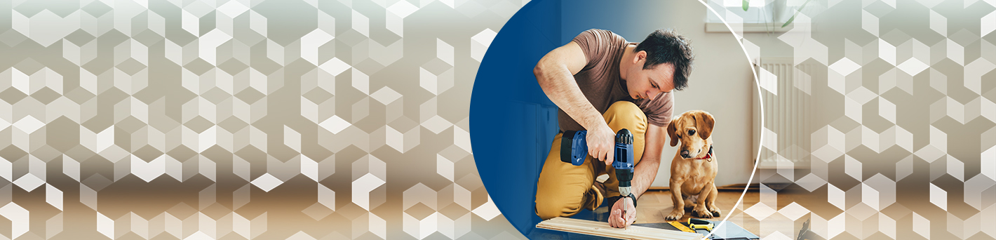 Man working on home improvements while his cute dog supervises
