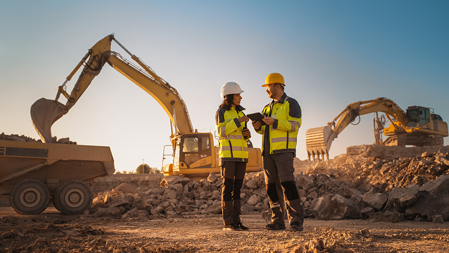 Man and woman on excavation job site
