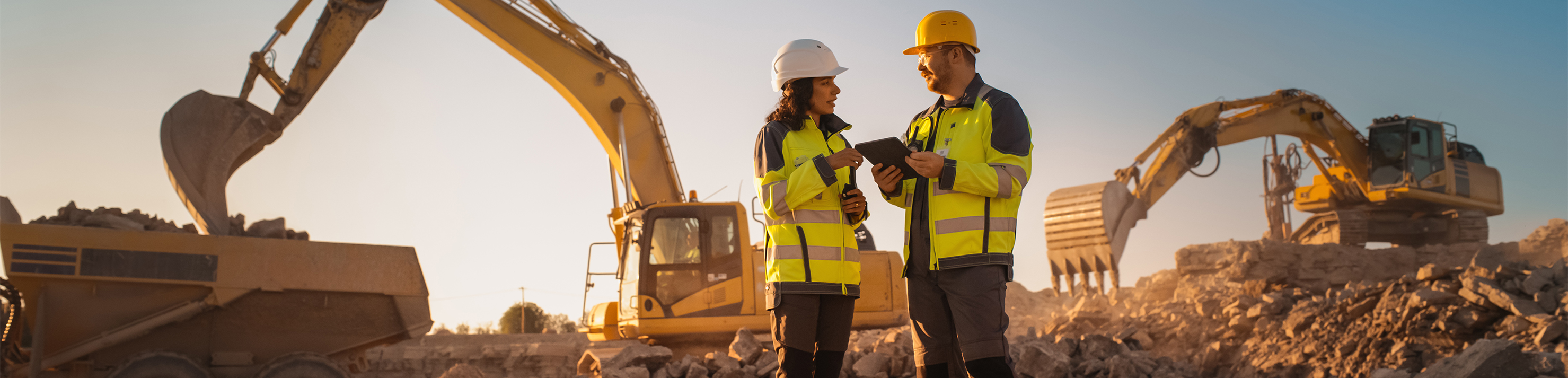Man and woman on job site talking